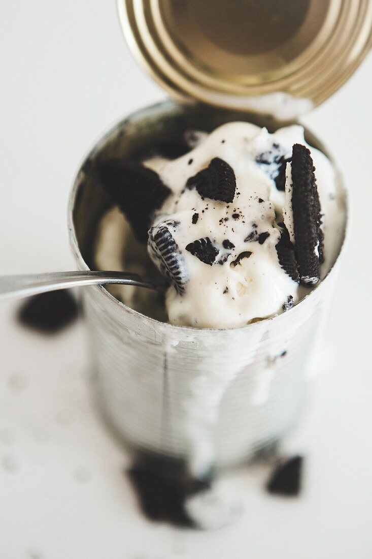 An ice cream dessert with Oreo cookies served in a tin can