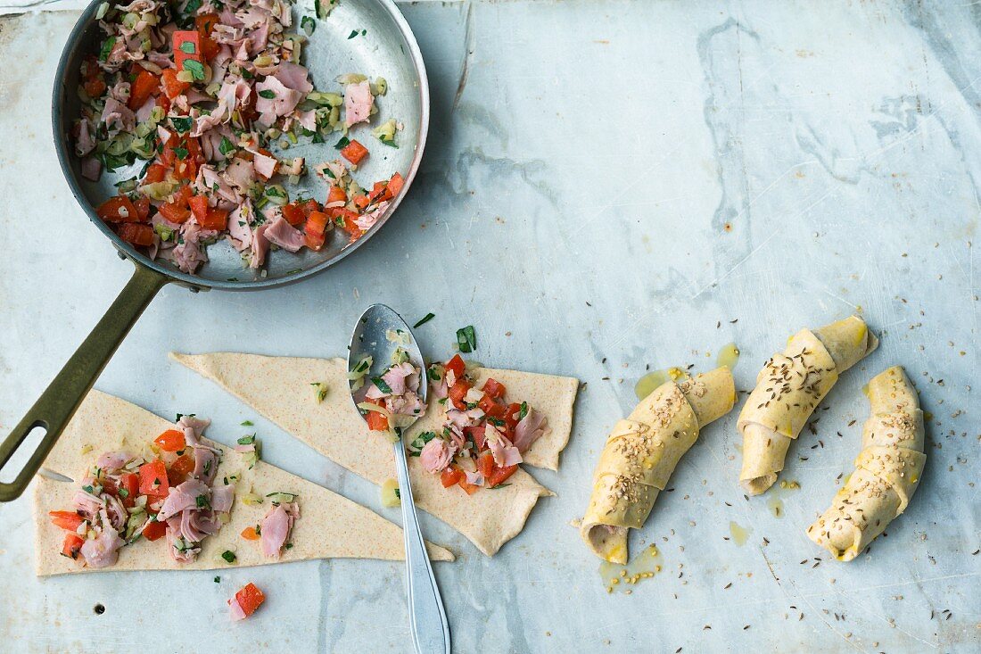 Savoury pastries being filled