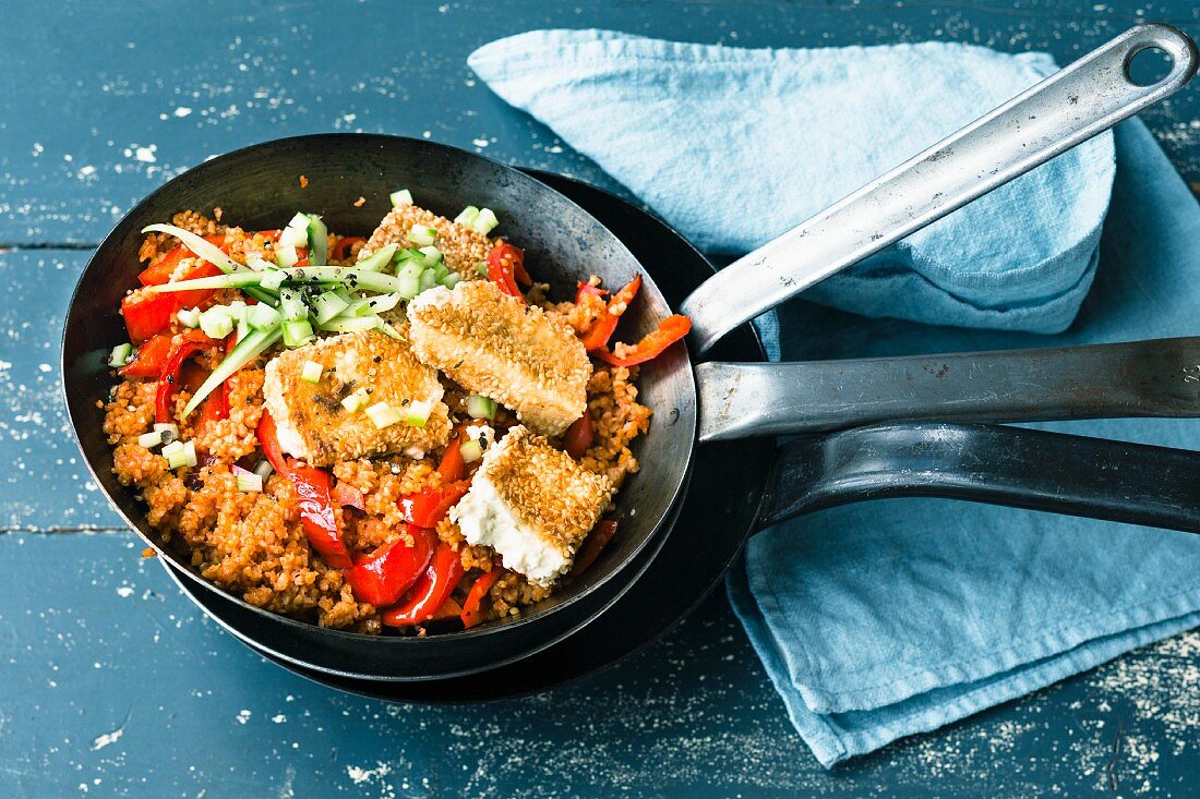 Fried bulgur and pepper with cucumber and sesame seed feta cheese