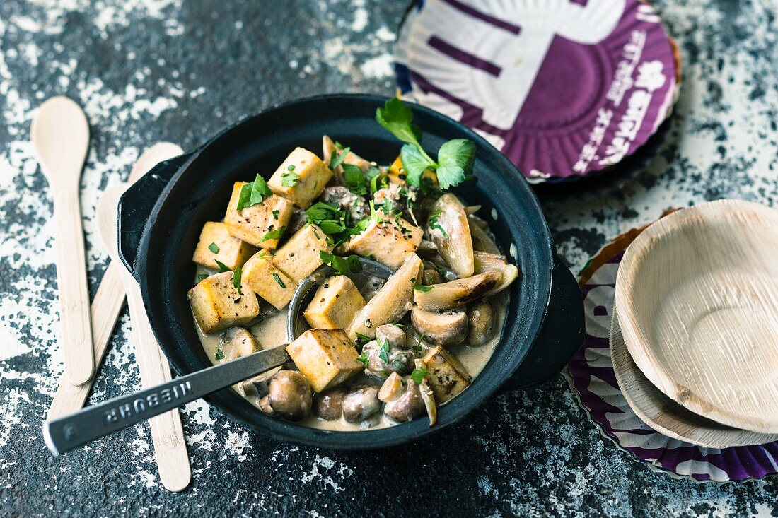 Vegan tofu ragout with mushrooms and parsley