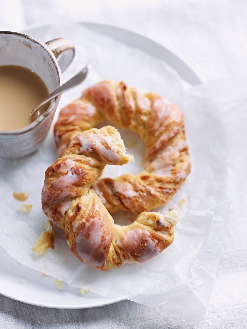 Iced croissants with a cup of coffee
