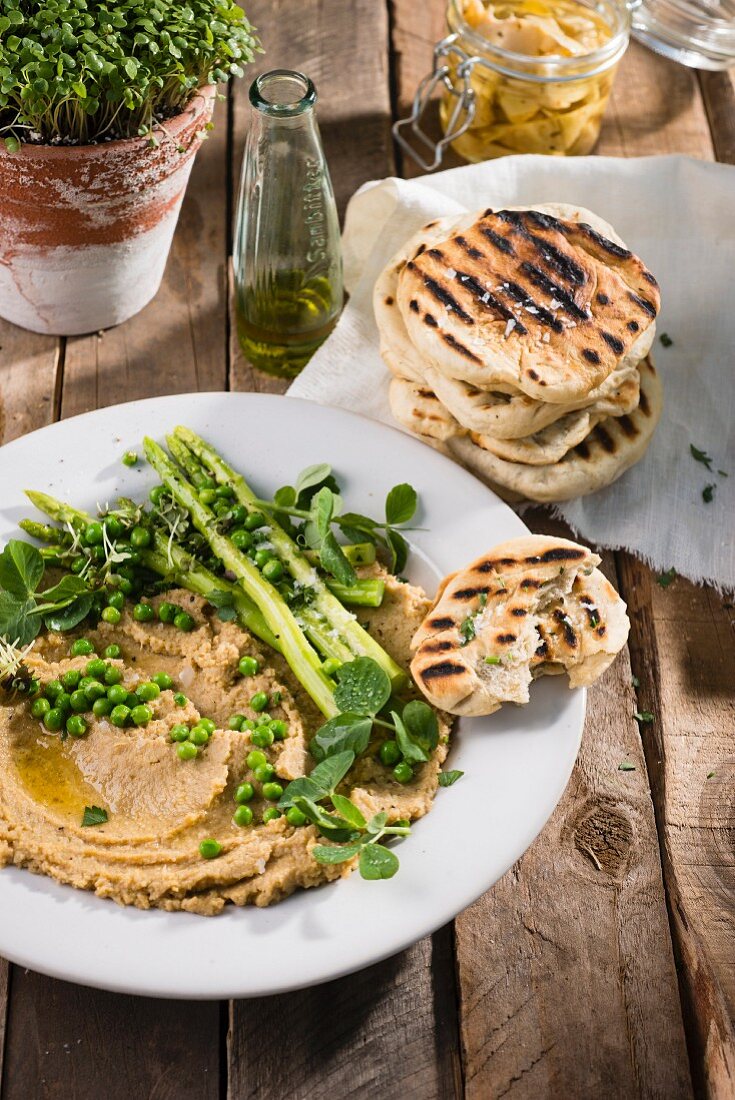Grilled flatbreads with hummus and spring vegetables