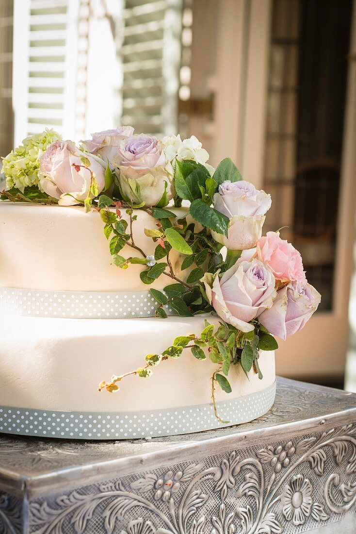 A two-layered cake with romantic rose decoration