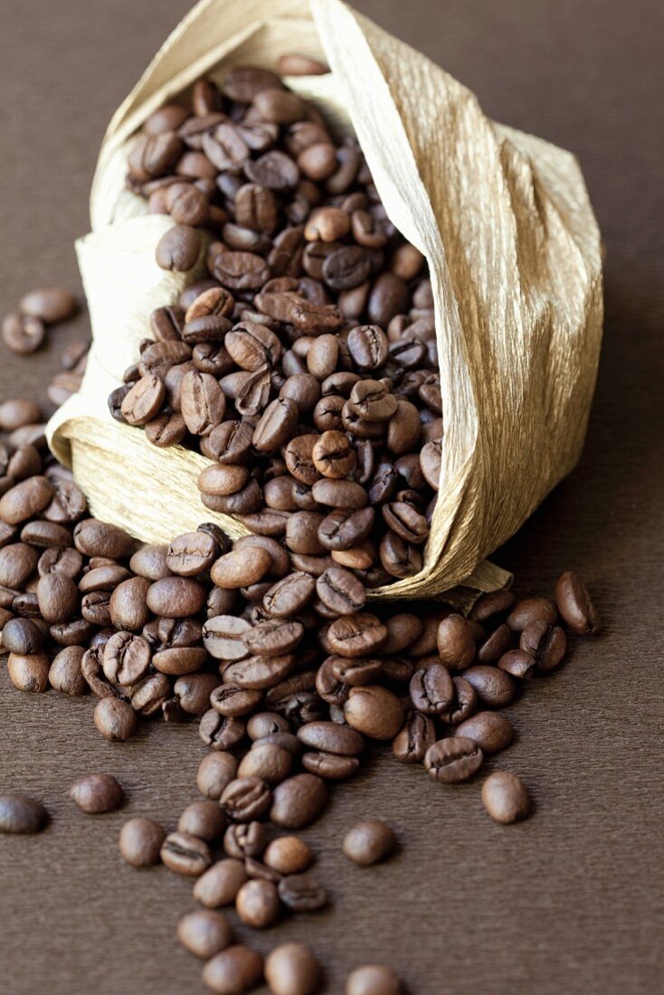 Coffee beans falling out of a sack