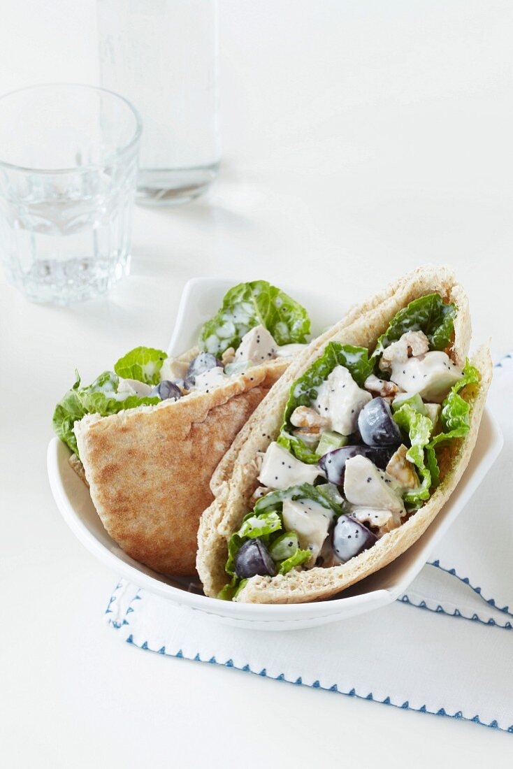 Chicken salad with grapes and walnuts in pita halves