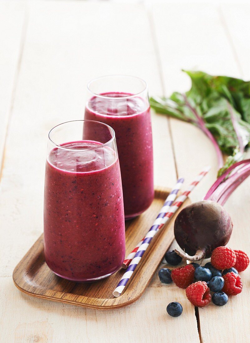 Berry and beet smoothies on a tray