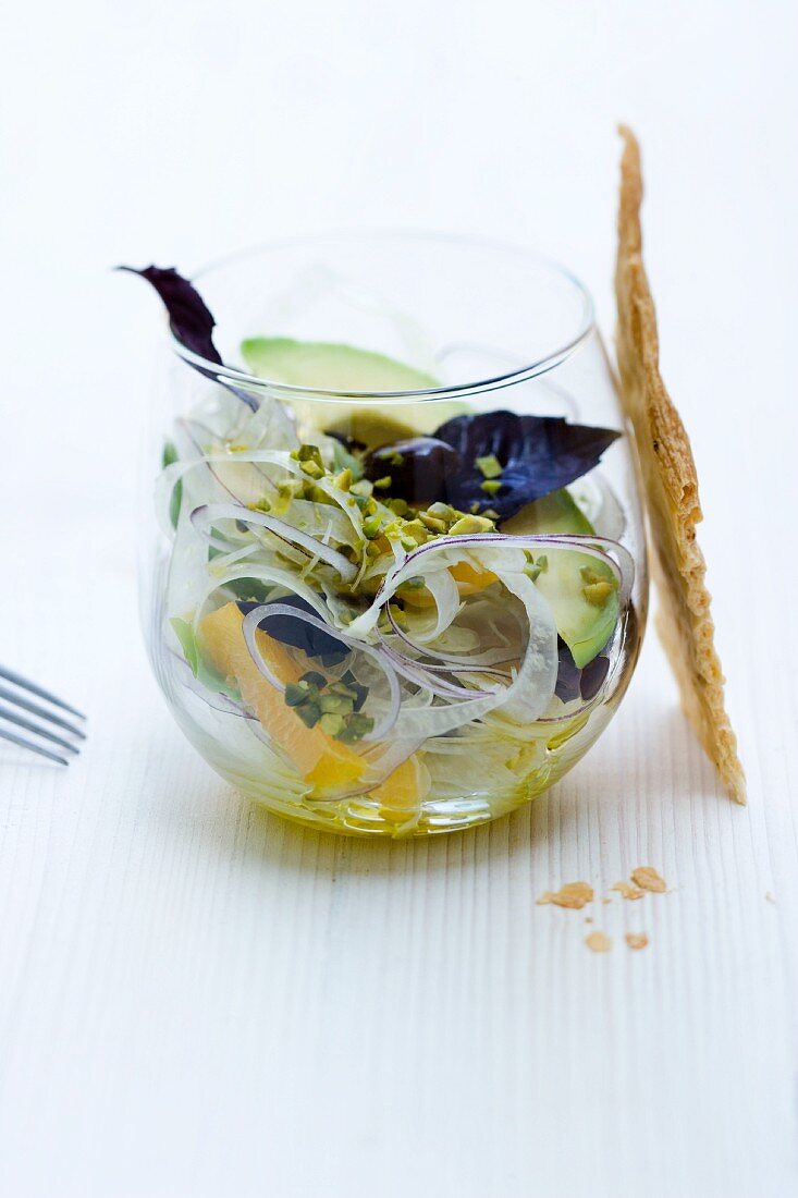 Fennel and avocado salad with oranges and pistachio vinaigrette in a glass
