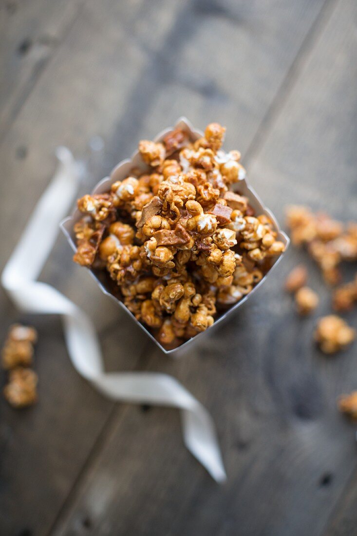 Homemade caramel popcorn with dried apple pieces