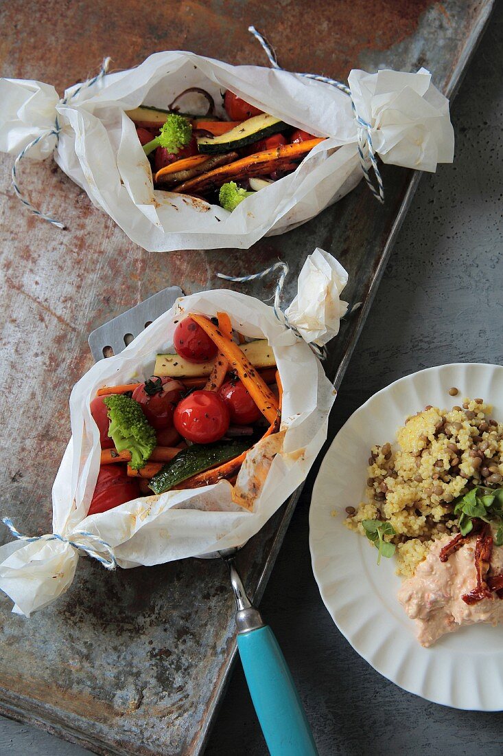 Oven-roasted vegetables with a millet and lentils, and a tomato dip