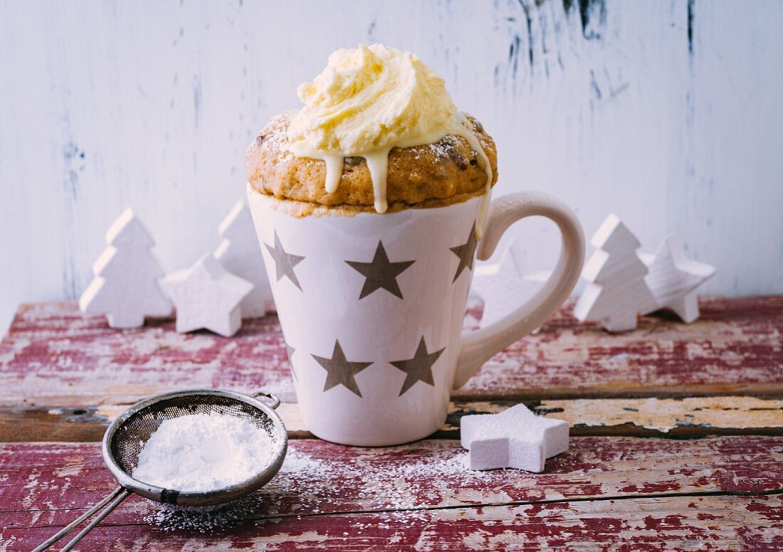 A Christmas mug cake with gingerbread spice and sultanas