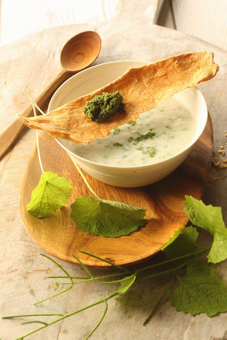 Kohlrabi soup with garlic rocket and crispbread with wild herb pesto