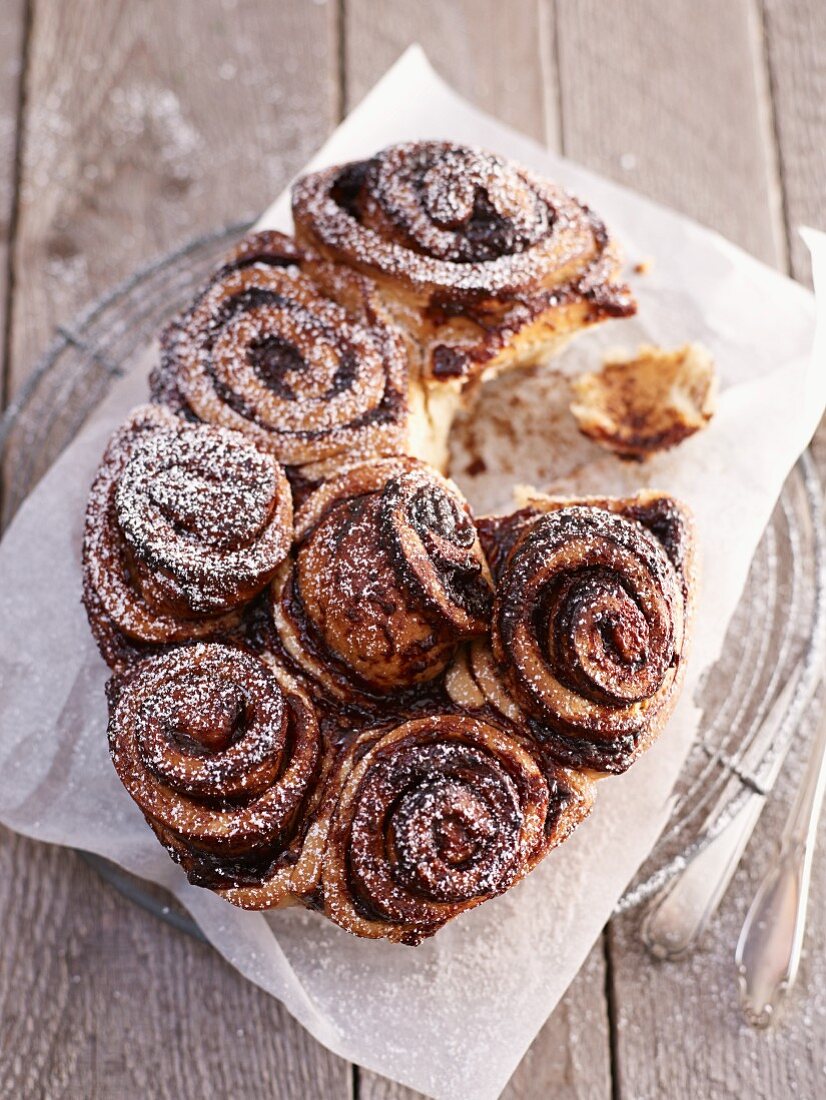 Poppy seed buns with plum jam and icing sugar