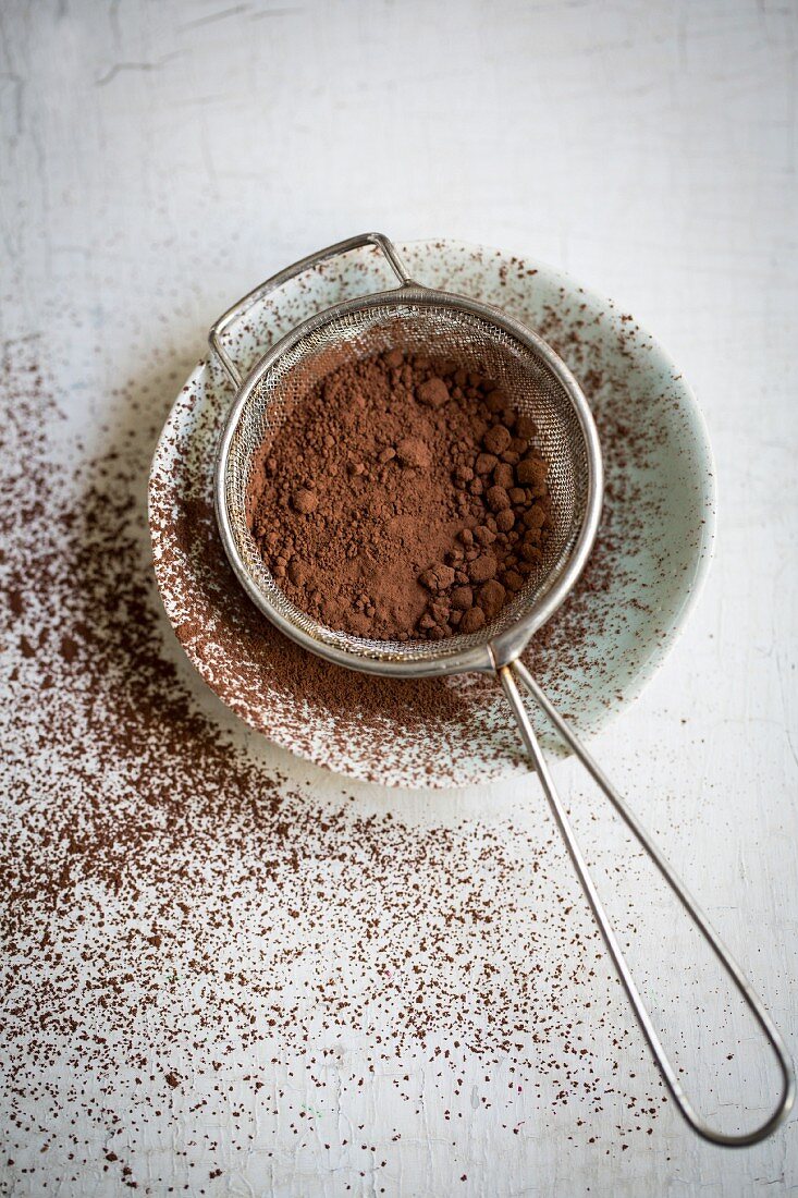 Cocoa in a sieve