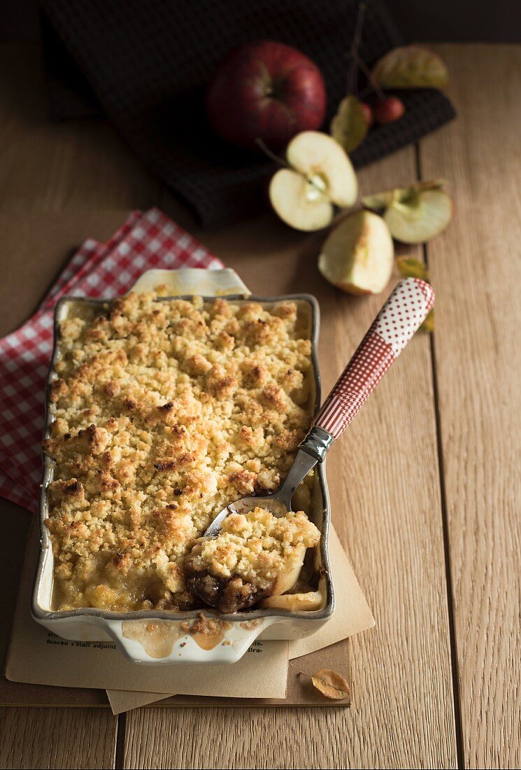 Apple and pear crumble in a baking tin