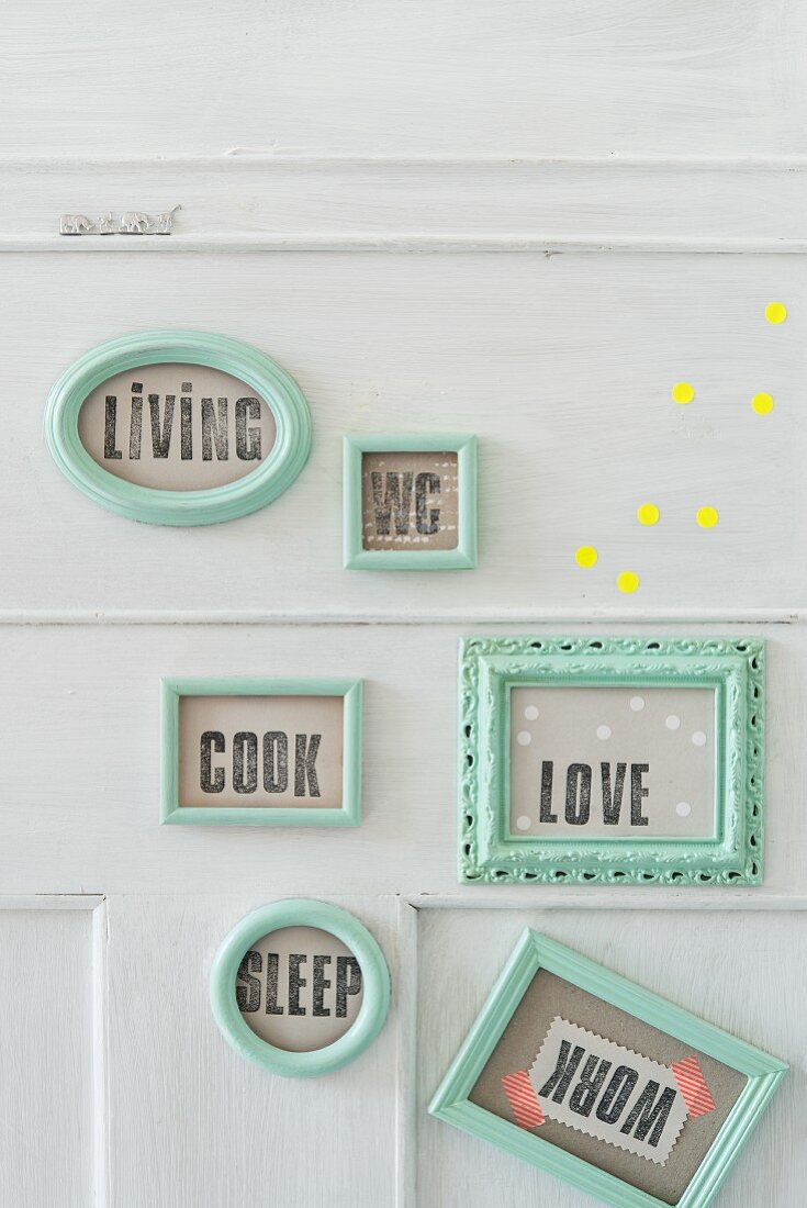 Homemade door plaques made from turquoise picture frames