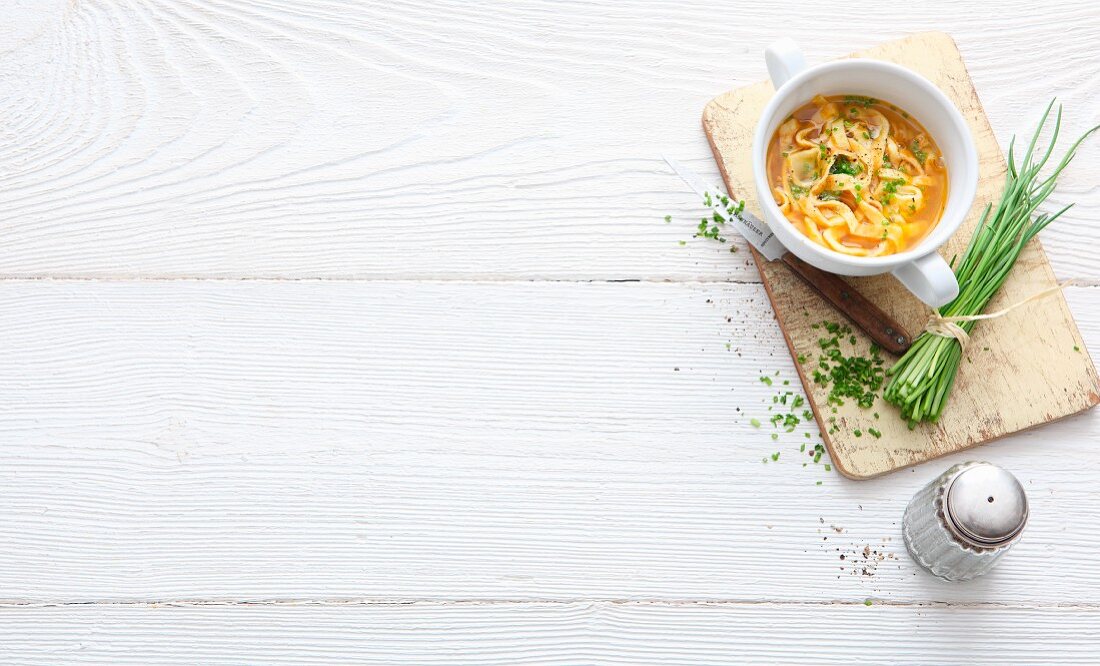 Pancake soup with fresh chives