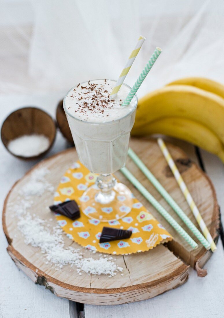 A coconut and banana smoothie in a sundae glass