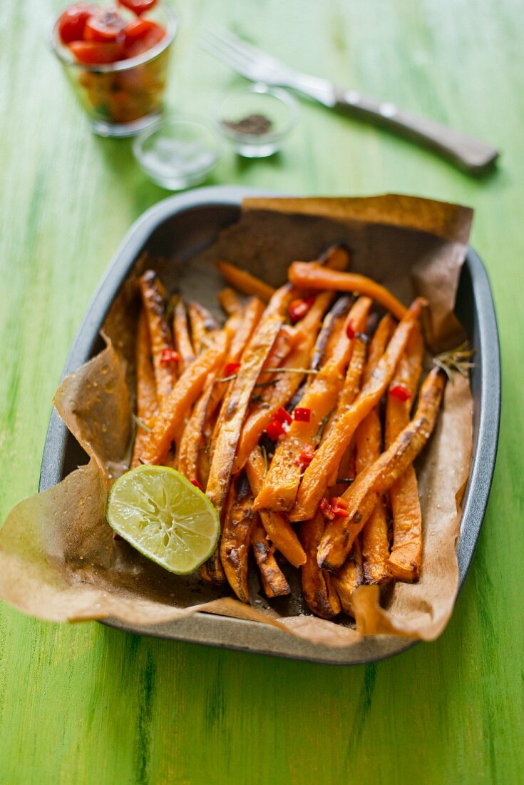 Baked yam roots on baking paper in a baking dish