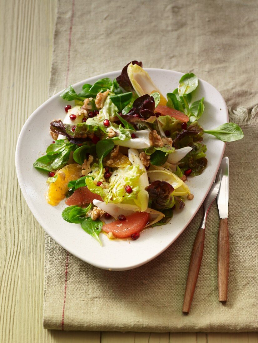 And advent salad with pomegranate seeds, oranges and grapefruit fillets