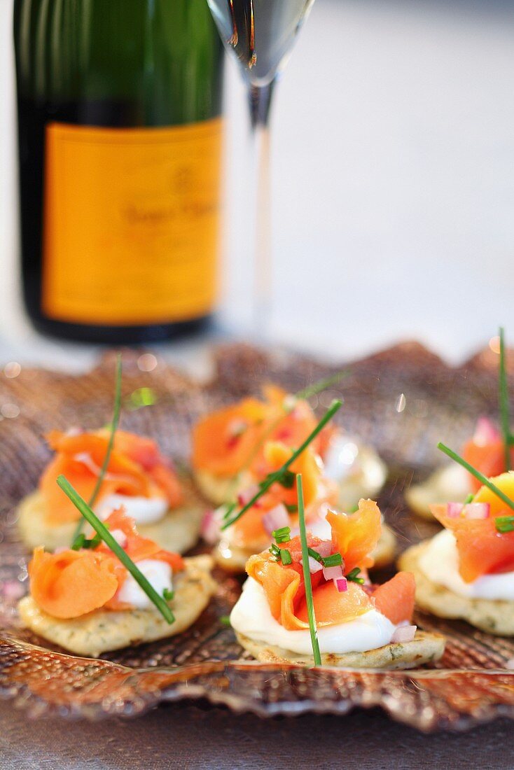 Salmon canapés served with champagne