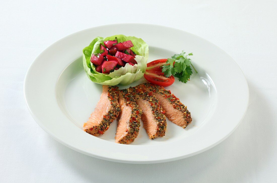 Salmon with a colourful pepper crust and a side salad