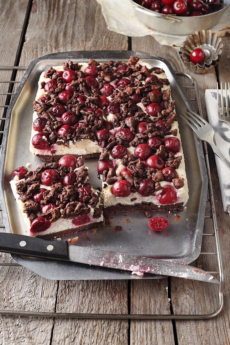 Chocolate tray bake with cherries and crumbles