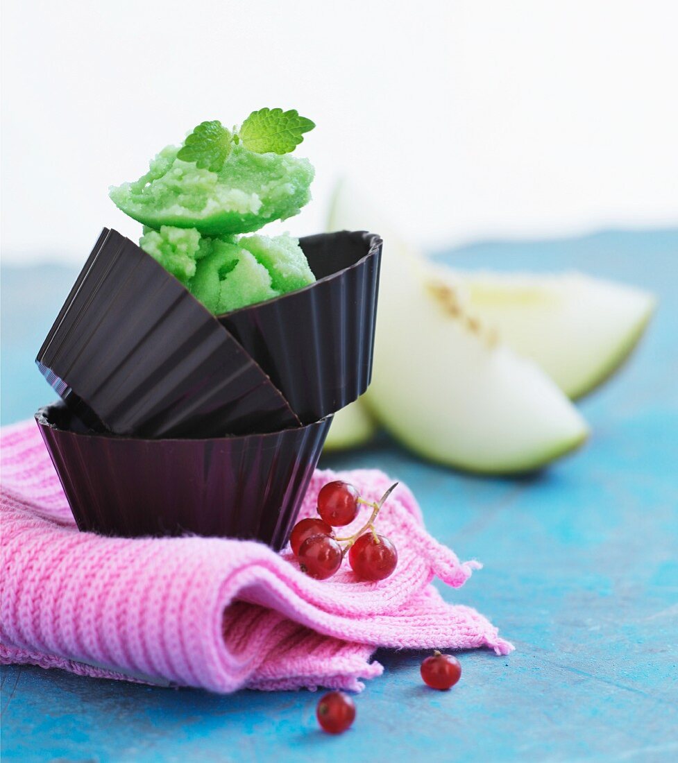 Melon sorbet in chocolate cases