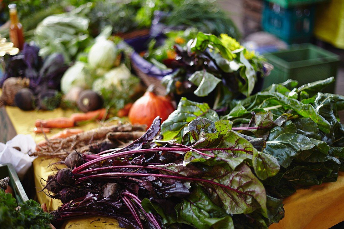 Fresh vegetables on a wooden table for sale at a market