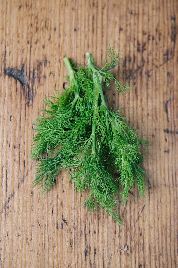 Fresh dill on a wooden table