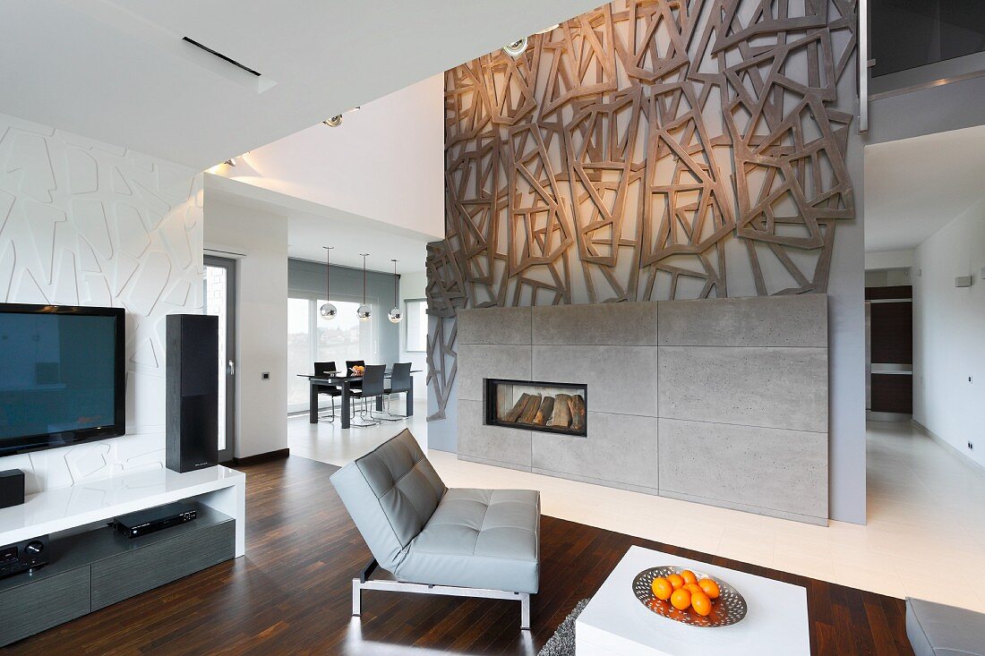 Open-plan interior with artistic fireplace