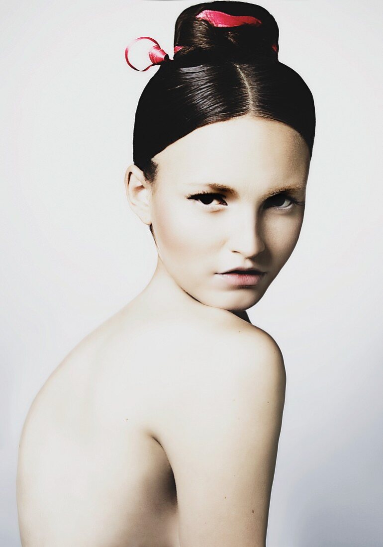 A young woman with a geisha-style hairstyle