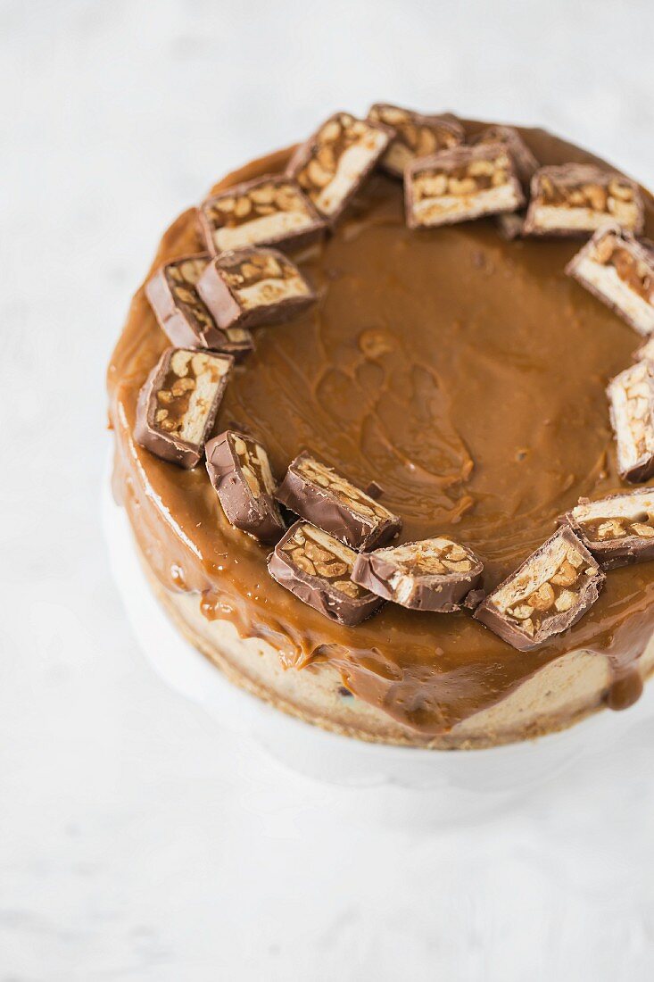 Snickers cheesecake with caramel ganache