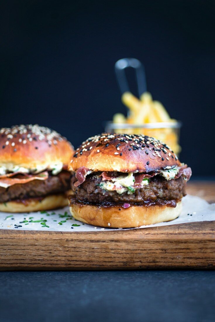 Blue cheese burgers on brioche buns with pancetta