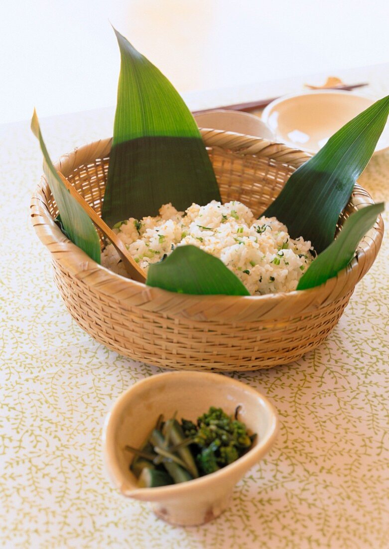 Rice with rapeseed in a bamboo basket