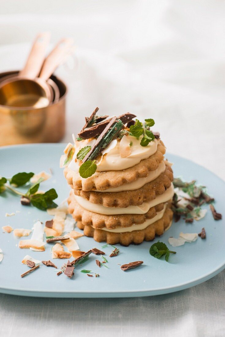 A stack of biscuits with mascarpone cream and peppermint