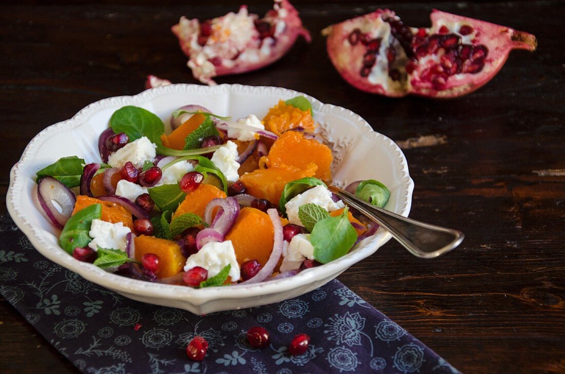 Pumpkin salad with feta cheese and pomegranate seeds