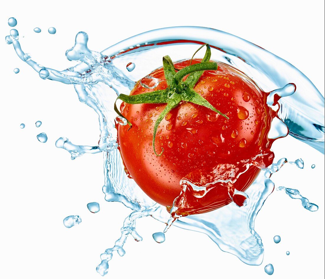 A tomato with a splash of water