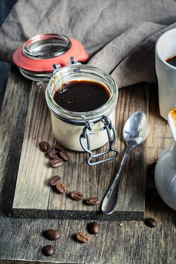 Panna cotta with coffee syrup in a flip-top jar