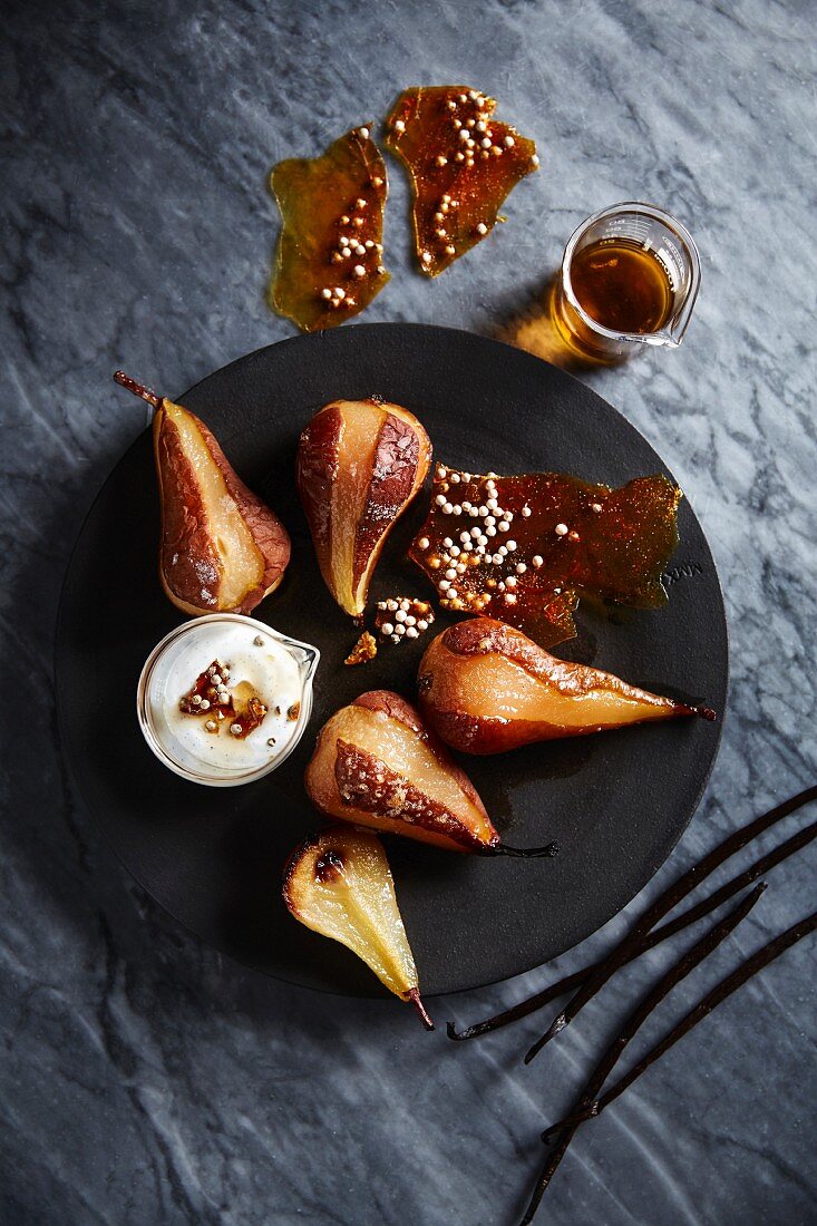 Pears roasted in honey and whiskey with pepper brittle