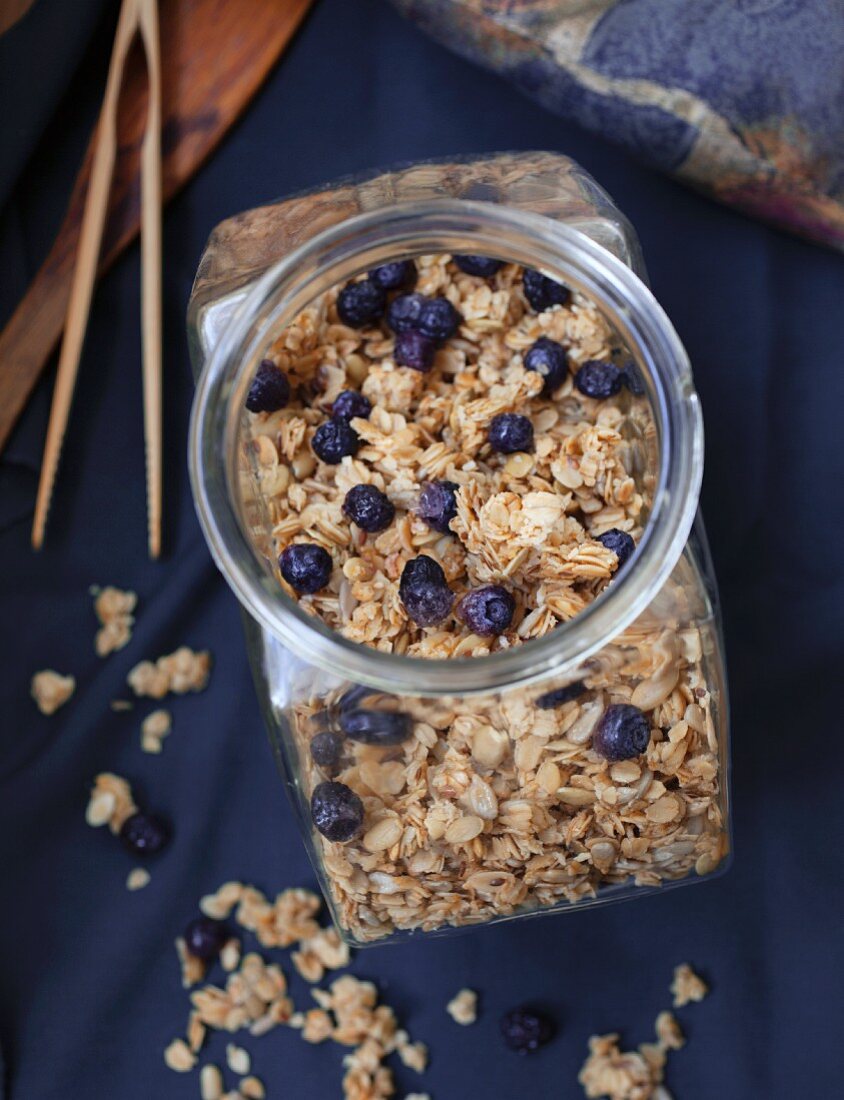 A jar of homemade muesli with blueberries