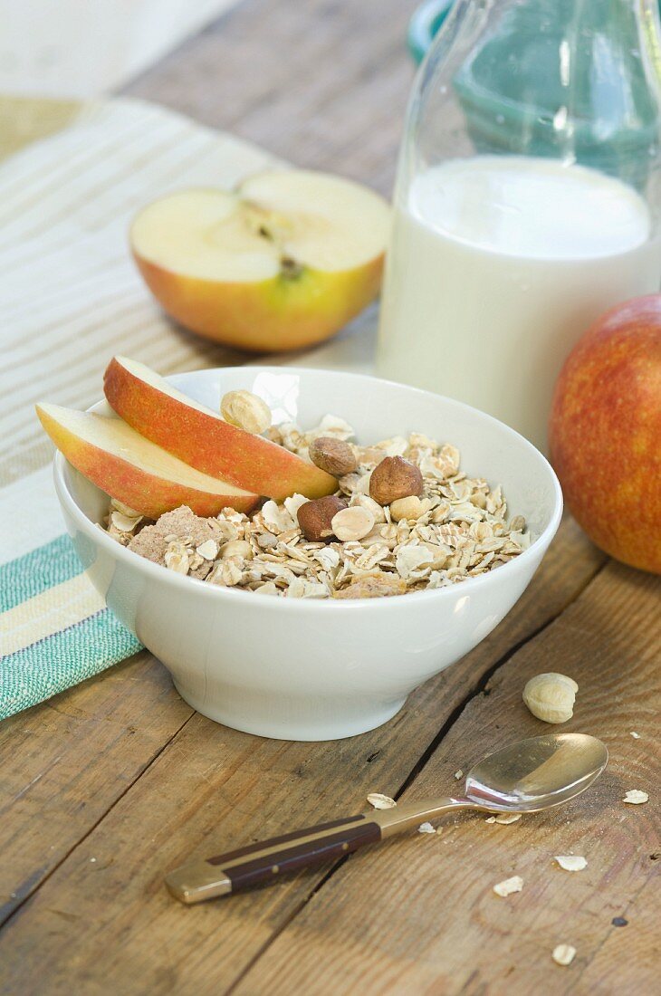A healthy breakfast: muesli with apple, nuts and milk