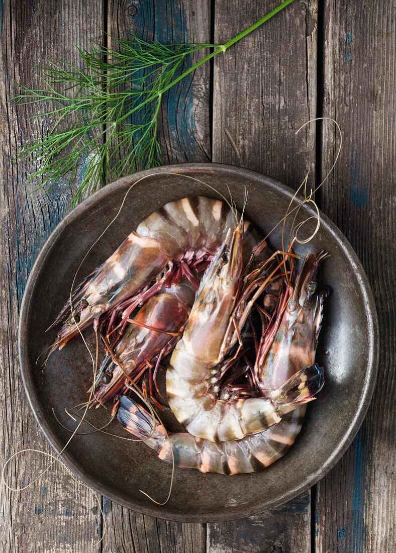 Raw king prawns and dill