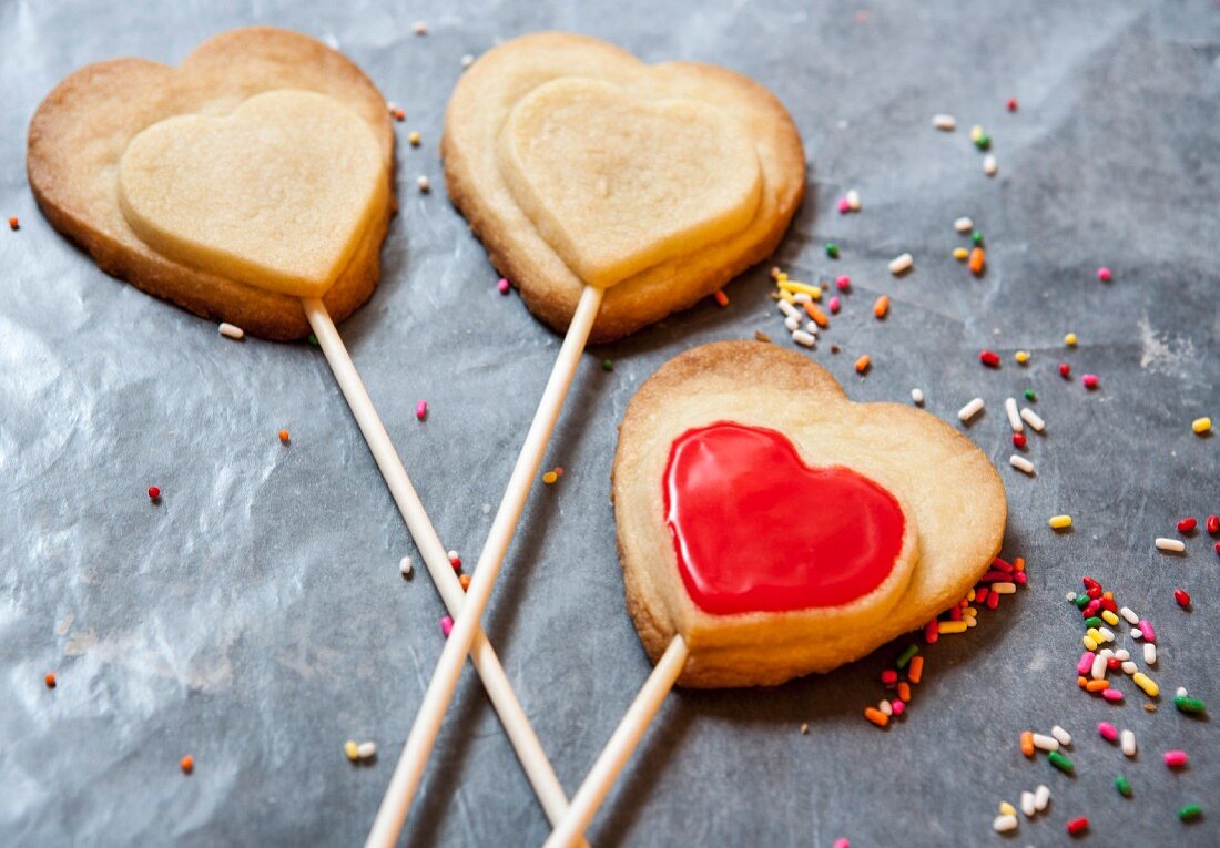 Heart-shaped shortbread biscuits on sticks