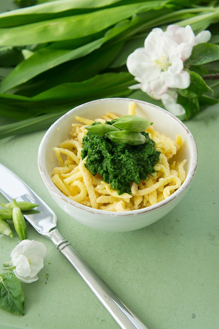 Spätzle (soft egg noodles from Swabia) with wild garlic purée and pickled wild garlic buds