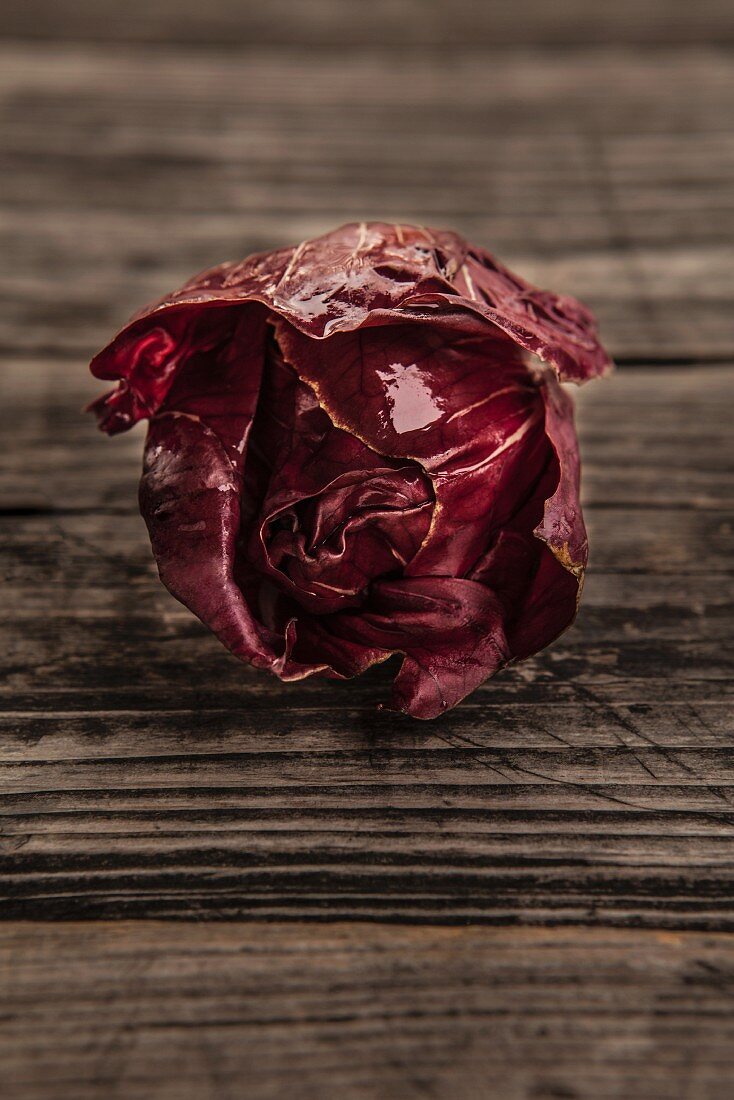 Fresh radicchio on an old wooden table