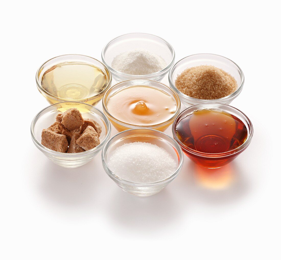 Natural sweeteners – clockwise from top: stevia, cane sugar, maple syrup, beet sugar, coconut flower sugar, agave syrup and honey
