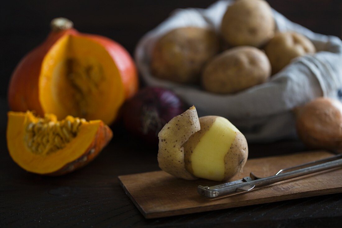 Ingredients for pumpkin soup with potatoes and onions