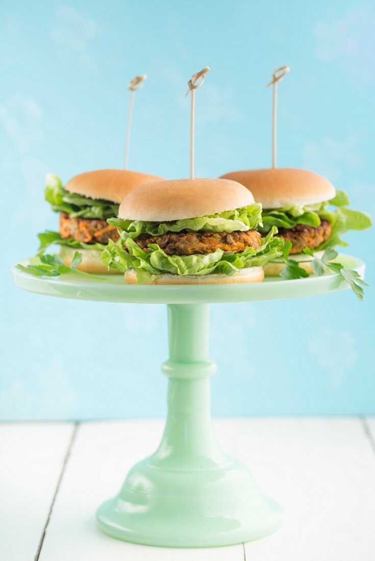Veggie burgers with lentil patties on a cake stand