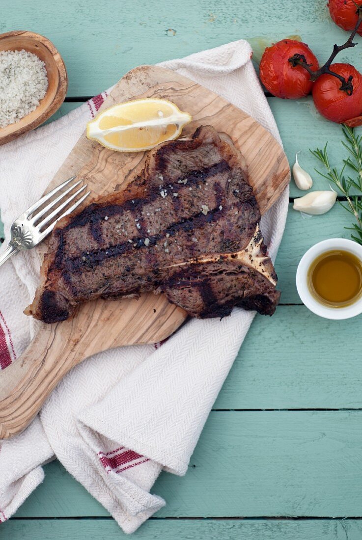 Grilled T-Bone steak on a chopping board