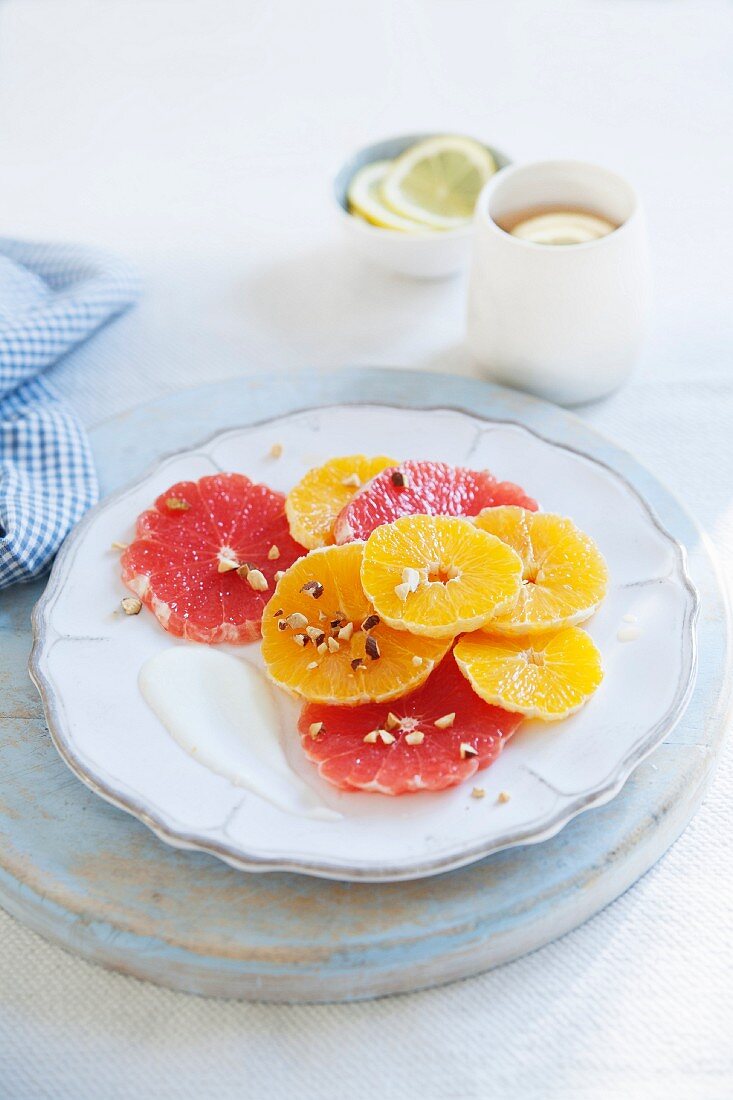 Citrus salad with pink grapefruit, oranges, nuts and yoghurt